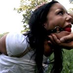 Fourth pic of Ball gagged brunette Angelica Heart in short skirt gets hogtied in the city park