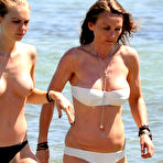 Third pic of Katharina Damm swimming topless in St. Tropez