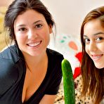 Fourth pic of Slim little lesbian Kristina Bell plays with her hot friend and masturbates with a cucumber.