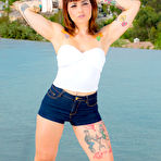 First pic of 
      Veronica Layke peels off her denim shorts by the lake
    