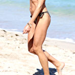 Third pic of Kelly Bensimon nipple slip in bikini on the beach