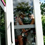 Third pic of Leggy sluts Jazzy Jay and Tina Twain suck and fuck in the phone booth and outside