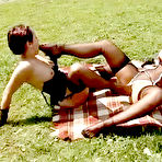 Second pic of Maria Mia and her friend both in nylon stockings insert feet in each others holes outdoors