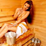 Third pic of Charming brunette Suzie Carina pours water on her bare breasts in sauna