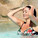 First pic of Busty Casey Batchelor sunbathing in bikini in a pool