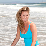 Third pic of Huge tits hottie Cassie Becker plays on a California beach in her tight swimsuit