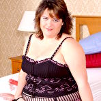 First pic of Elegant brunette fattie Lizzy in beautiful black lingerie sucks red dildo in the bedroom