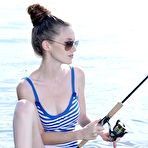 First pic of Brunette teen Emily Bloom goes fishing in her short dress and exposes her hairy pussy outdoors.