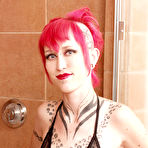 First pic of Short haired inked up alt redhead Jax shows off her tattoos in the shower