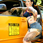 First pic of Inked up Adahlia strips nude and shows her naughty parts beside yellow taxi