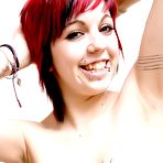 Second pic of Topless alt redhead Danie Chaos shows off her shapely tits, tattoos and pierced nipples