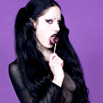 First pic of Raven haired pigtailed goth chick Fetus de Milo with lollipop poses topless in pantyhose