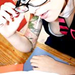 First pic of Inked up four-eyed schoolgirl Dizzee doing her homework and sucking a lollipop