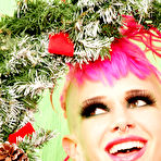 Fourth pic of Petite alt chick Roxy Contin with pink hair and bald pussy pretends that she's the Xmas tree