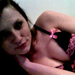 Third pic of Freckles is a lithe brunette and she is teasing her fans by stripping out of her lingerie in bed