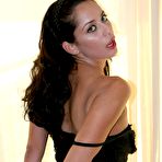 Third pic of Dark haired temptress Paizley Adams strips out of her short black dress and thong panties
