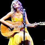Fourth pic of Taylor Swift in yellow dress at Country Music Hall Of Fame stage