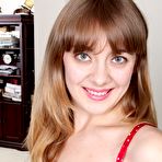 First pic of Stylish MILF with bangs gets completely naked in the living room - IamXXX.com