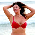 First pic of Lisa Appleton flashes her nipples on a beach in Spain