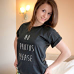 First pic of Colorfully dressed and lovely-looking brunette teen undressing on a bed - aMetart.com