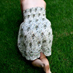 Second pic of Shoeless blonde Kelly Space in nice summer dress shows off her lovely feet outdoors