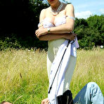 Third pic of Mistress Lady Sonia rides the slave and tramples his body under the blue skies