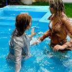 Fourth pic of Tatiana Milovani gets in the outdoor pool with her silver satin suit on