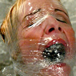 First pic of Sierra Sinn gets smothered in a big glass tank with water after rope bondage