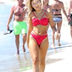 First pic of Tallia Storm in red bikini on a beach