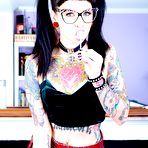 First pic of Tattooed Necro Nicki in pigtails & short skirt on knees showing tight ass - PornPics.com