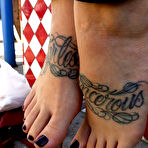 Third pic of Blonde Manchester shows off her tattooed feet and dirty soles in public place