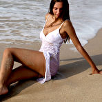 Second pic of Free Elin displays her smoldering body as she strips by the beach.