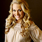 Fourth pic of Carrie Underwood posing as cowgirl in nature