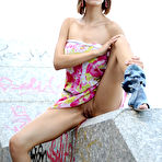 Third pic of Suzanna A sensually poses outdoors as she strips her beautiful dress.