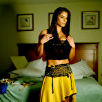 Fourth pic of Well stacked muscle brunette Davana Medina poses clothed in her bedroom