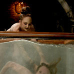 First pic of Audrey Leigh gets strapon fucked from behind right in a big water tank made of glass