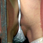 Fourth pic of SexPreviews - Mei Mara petite in white stockings is bound in metal cage by lezdom