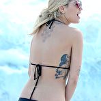 First pic of Rita Ora in black bikini on a beach in Miami