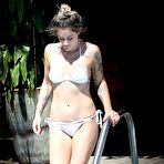 Third pic of Katie Waissel sunbathing in white bikini