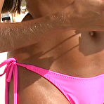 Second pic of Sunbathing Lori Anderson in shades and pink bikini gives a close-up of her arm hair 