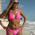 Fourth pic of Sunbathing Lori Anderson in shades and pink bikini gives a close-up of her arm hair 