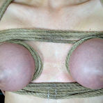 Third pic of SexPreviews - Cherry Torn busty blonde is rope bound in spread with ballgag made to cum