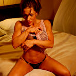 Third pic of Big titted muscle brunette Mia SheMuscleGym poses in the bedroom wearing see through underwear