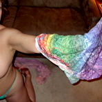 Third pic of Busty Bliss - Hot busty cougar poses in her tie dyed skin tight top and flips the bird