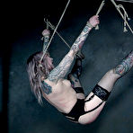 Fourth pic of SexPreviews - Rose Quartz tattoo babe in garter stockings is rope bound and toyed in dungeon
