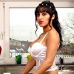 First pic of A perfect gypsy bitch in white wedding stockings and noble big breasts posing in the kitchen and drink coffee