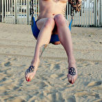 Third pic of Inked up blonde Voltaire strips nude and goes on the swings in her bare skin