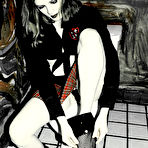 Third pic of Goth girl Keiko in red plaid skirt and black stockings displays her shaved spot