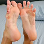 Third pic of April ONeil and her nude lesbian friend compare their feet and play with their snatches