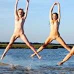 Third pic of Hot lesbian babes Yara A, Mari B and Uma B love to pose nude in the ocean.